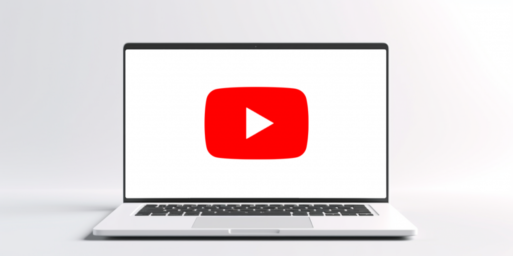 Ноутбук с логотипом YouTube на экране.